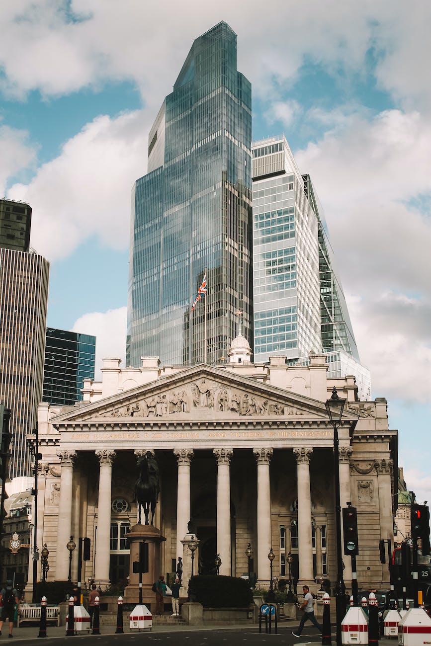 bank of england in front of a skyscraper in london uk
