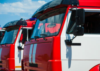 Car pool with fire engines of fire department